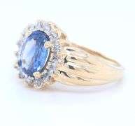 Handsome Yellow Gold 1.80ct Oval Blue Sapphire and Diamond Halo Ring