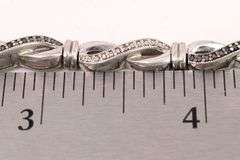 Sterling Silver Diamond and Blue Sapphire Infinity Bracelet
