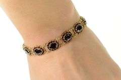 10K Yellow Gold Oval Garnet Halo Encrusted Statement Bracelet