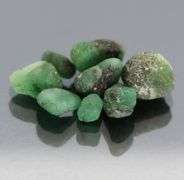 Collectable 10.50ct uncut Emerald set