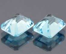 Dazzling 12.85ct vivid blue emerald cut Topaz pair