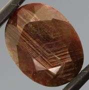 Shimmering metallic 9.12ct earth toned faceted Sapphire
