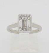 Emerald Cut Diamond in a Bezel Setting