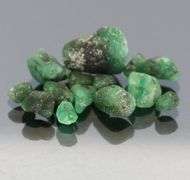 Untreated 10.13ct collectors uncut Emerald set