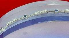 CERTIFIED 18K WHITE GOLD DIAMOND AND SAPPHIRE BRACELET.