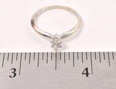 Delightful 14K white Gold Solitaire Diamond Ring