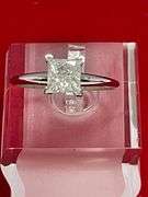 CERTIFIED BRAND NEW LADIES 14K WHITE GOLD SOLITAIRE DIAMOND RING.
