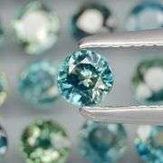 Heated only! 4.12ct blue green Sapphire set