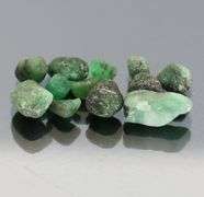 Collectable 10.52ct uncut Emerald set
