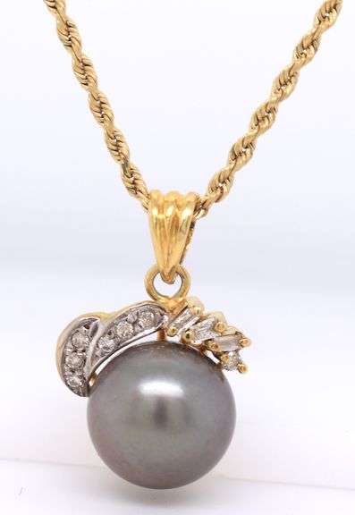 Set of 14kt yellow gold black pearl and diamond jewelry