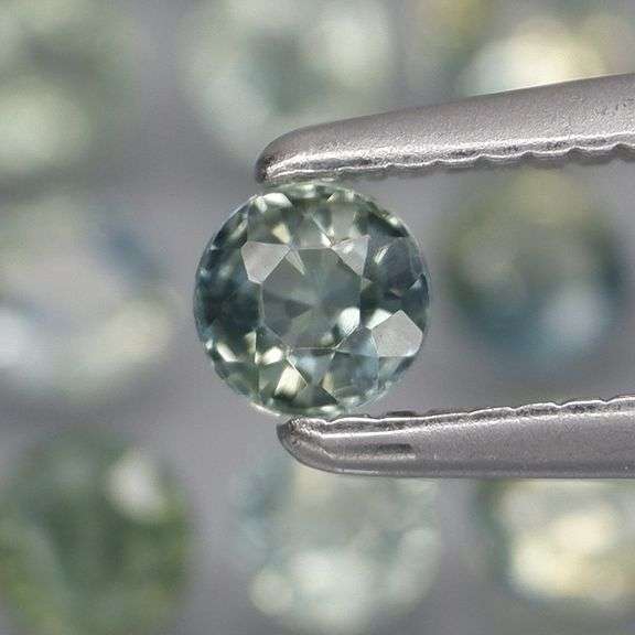Heated only! 3.35ct blue green Sapphire set