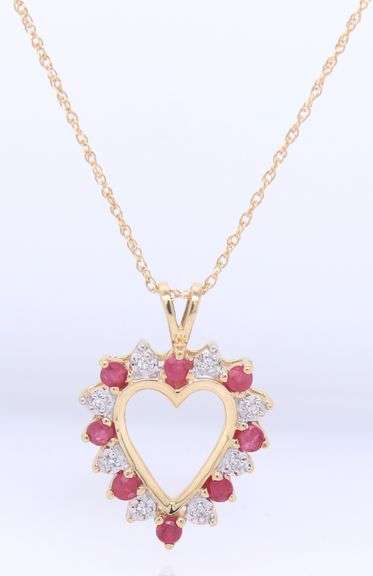 10kt Yellow gold ruby and diamond heart shaped pendant on chain necklace