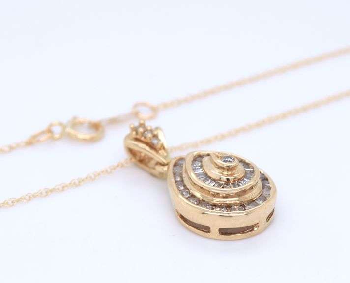 10kt Yellow gold Baguette and RBC diamond pendant on chain with matching earrings