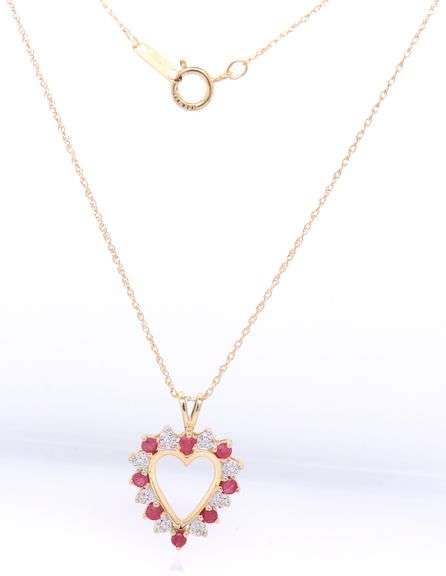 10kt Yellow gold ruby and diamond heart shaped pendant on chain necklace