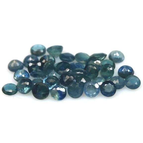 Heated only! 7.74ct greenish blue sapphire set
