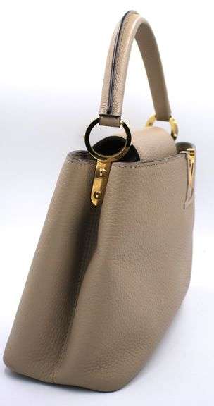 Authentic Louis Vuitton Taurillon calf skin leather in beige Capucines BB Galet handbag