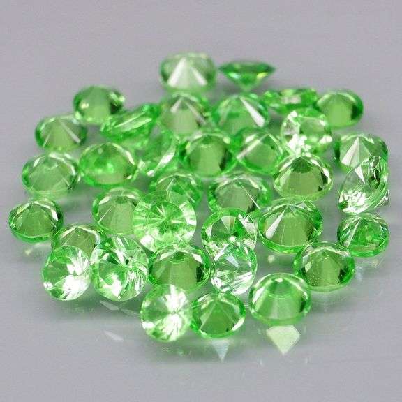Rare 2.44ct untreated bright green Tsavorite set