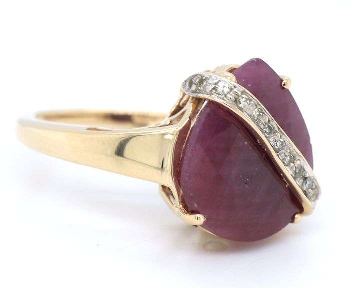 10kt Yellow gold Pear ruby and diamond ring with bar over ruby
