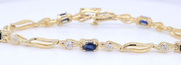14kt Yellow gold 2.50ctw sapphire and diamond bracelet