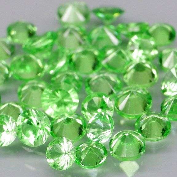 Rare 2.44ct untreated bright green Tsavorite set
