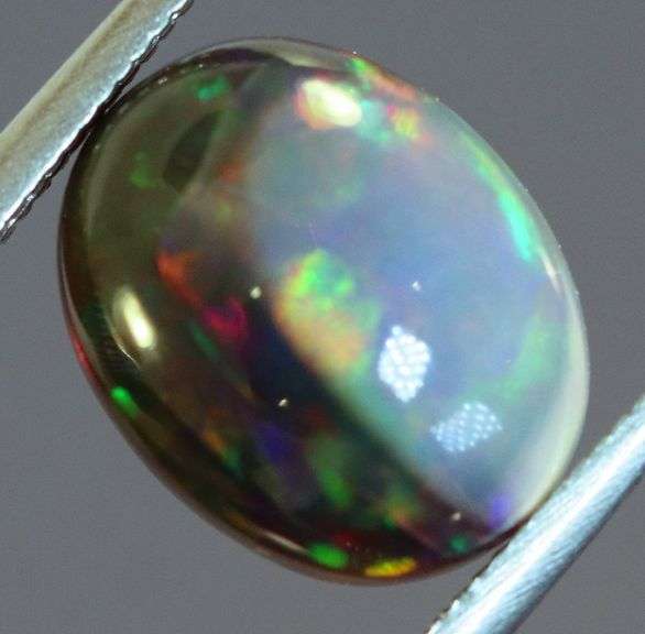 Fiery flashing 1.92ct Ethiopian bi-color Opal