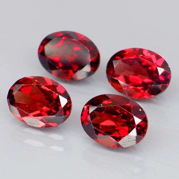 Amazing 5.88ct oval cut cherry red Garnet set