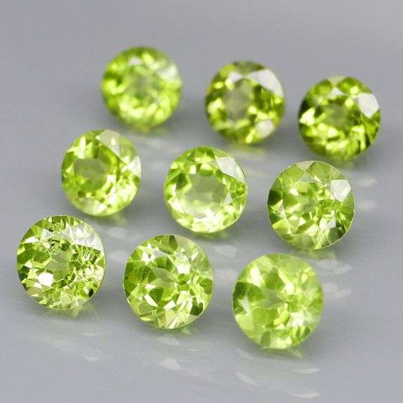 Fantastic 4.90ct 5mm round brilliant cut Peridot set