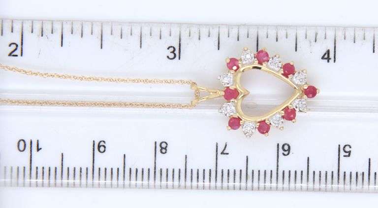 10kt Yellow gold ruby and diamond heart shaped pendant on chain necklace