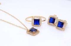 Set of 18kt yellow gold blue synthetic sapphire and CZ ring, earrings and necklace