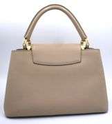 Authentic Louis Vuitton Taurillon calf skin leather in beige Capucines BB Galet handbag