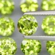 Fantastic 4.90ct 5mm round brilliant cut Peridot set