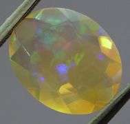 Captivating 1.62ct fully faceted fairy fire jelly Opal