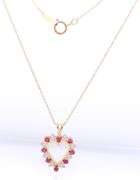 10kt Yellow gold ruby and diamond heart shaped pendant on chain necklace