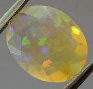 Captivating 1.62ct fully faceted fairy fire jelly Opal