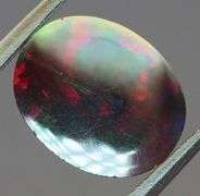 Fiery flashing 1.92ct Ethiopian bi-color Opal