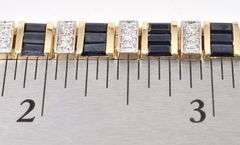 Ravishing Diamond and Sapphire Bracelet in 14K Yellow Gold