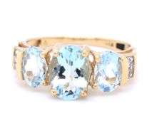 14kt Yellow gold 2ctw oval aquamarine and diamond accent 3 stone ring