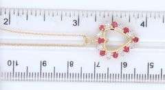 10kt Yellow gold ruby and diamond heart shaped pendant on chain necklace