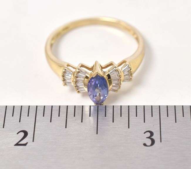 A Ravishing Tanzanite and Diamond Ring in 14K Yellow Gold