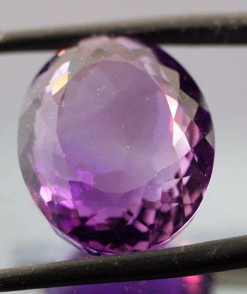 Halo flashing 24.64ct unheated Bolivian Amethyst