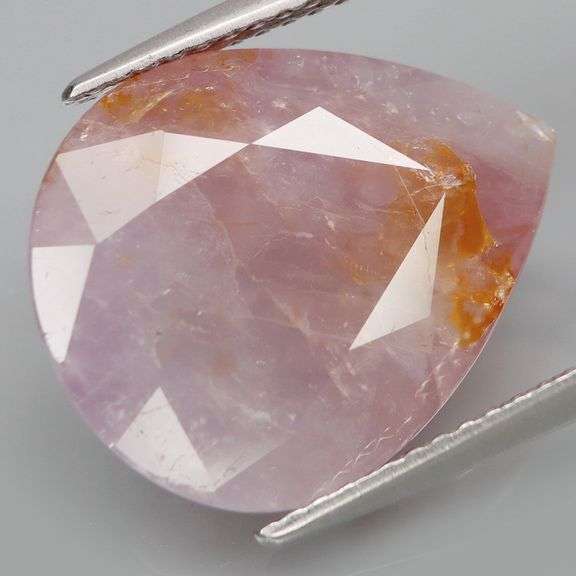 One of a kind 12.49ct lavender and orange Sapphire!