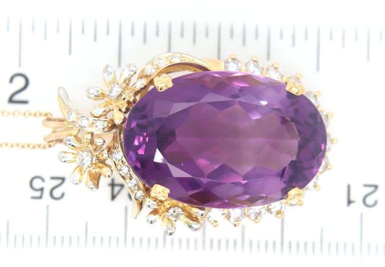 18kt Yellow gold oval Amethyst with diamond around pendant on chain
