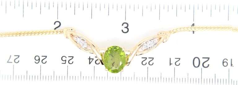 14kt Yellow gold oval Peridot and diamond accent V necklace