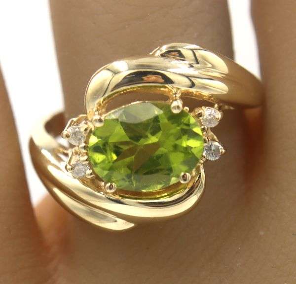14kt Yellow gold oval Peridot and diamond accent ring