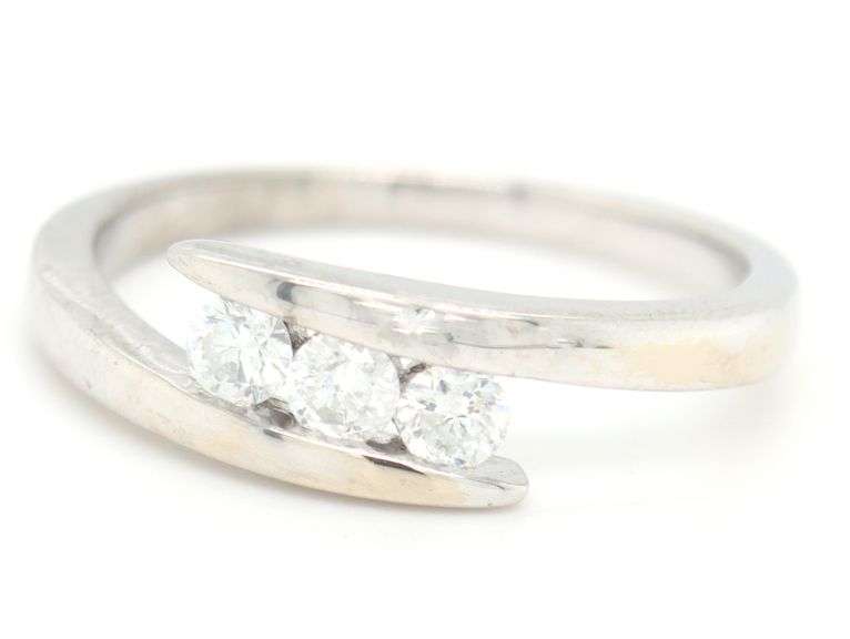 14kt White gold 0.35ctw 3 stone diamond bypass band