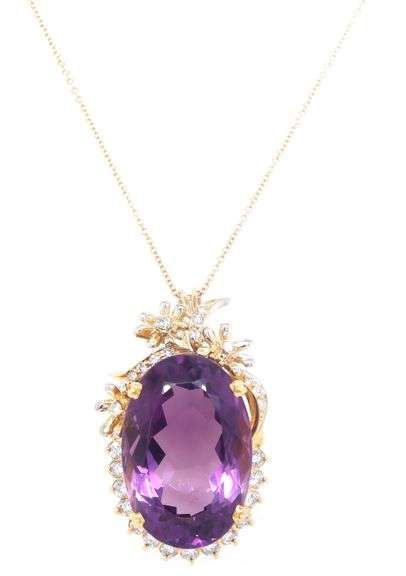 18kt Yellow gold oval Amethyst with diamond around pendant on chain
