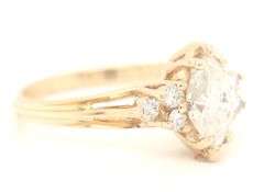 14kt Yellow gold 1ct marquise in 0.12ctw diamond setting