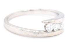 14kt White gold 0.35ctw 3 stone diamond bypass band
