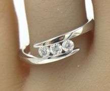 14kt White gold 0.35ctw 3 stone diamond bypass band