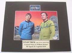 HAND SIGNED LEONARD NIMOY AND WILLIAM SHATNER 5X7 IN AN 8X10 MATTED DISPLAY WITH COA.